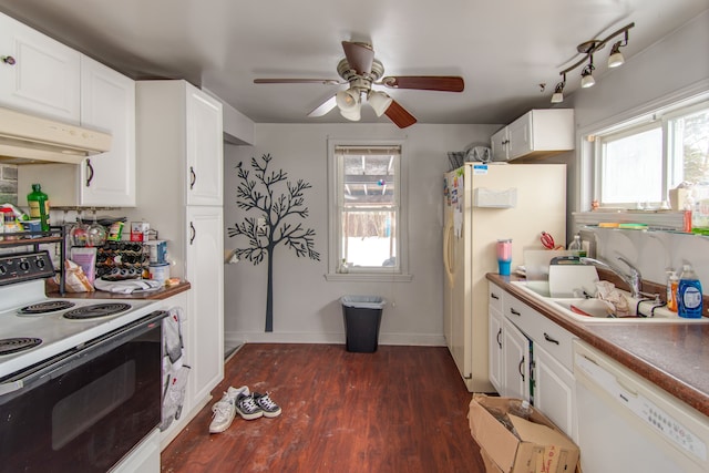 kitchen featuring dark hardwood / wood-style flooring, a healthy amount of sunlight, white appliances, and white cabinets