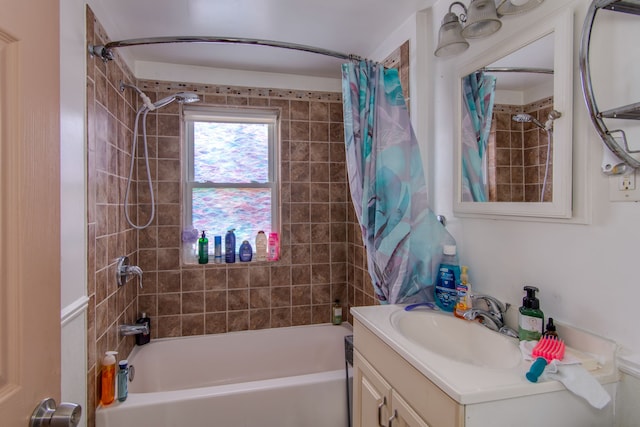 bathroom featuring shower / bath combo and vanity