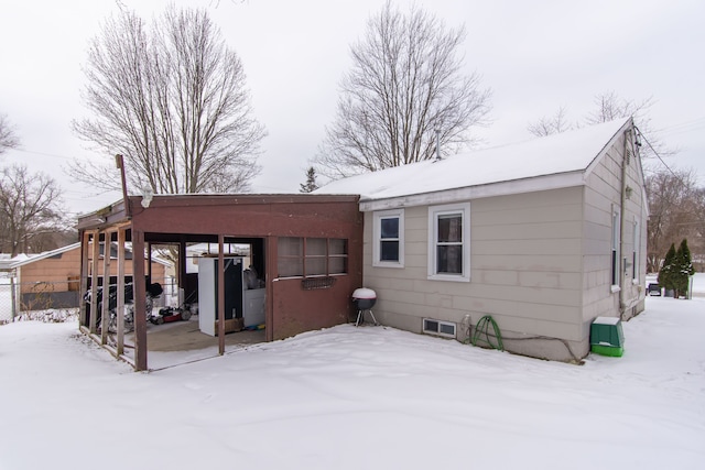 view of snow covered house