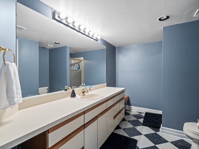 bathroom with vanity and toilet