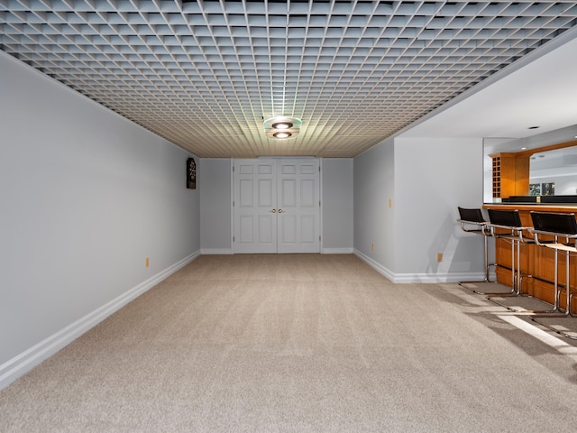 basement featuring carpet flooring