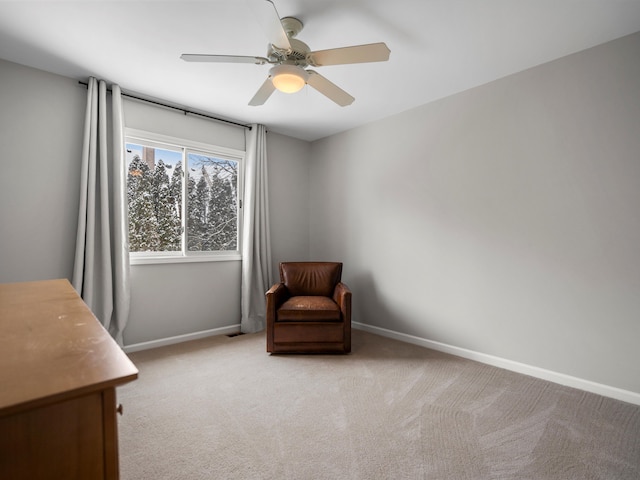 sitting room with light carpet and ceiling fan