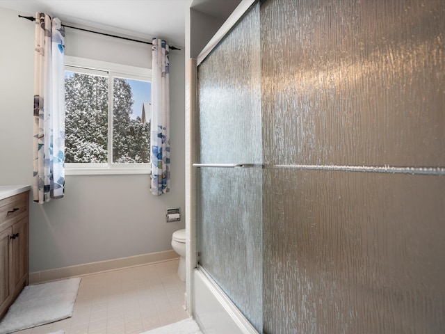 full bathroom featuring vanity, enclosed tub / shower combo, and toilet