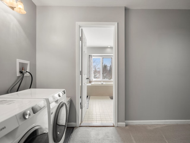 laundry area featuring separate washer and dryer and carpet