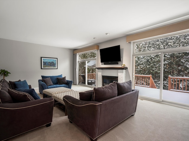 living room featuring a brick fireplace and light colored carpet