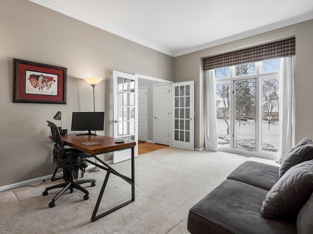 carpeted office with crown molding and french doors