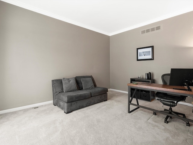 carpeted home office featuring crown molding