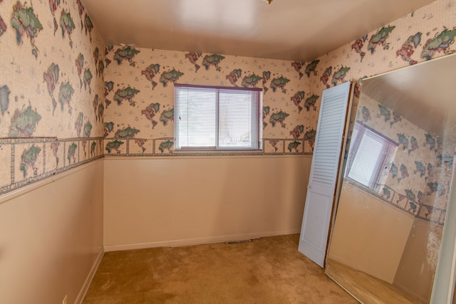 interior space featuring light colored carpet