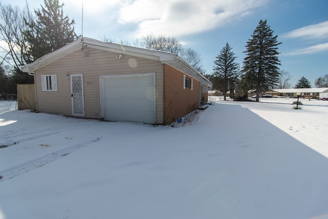 view of snow covered garage