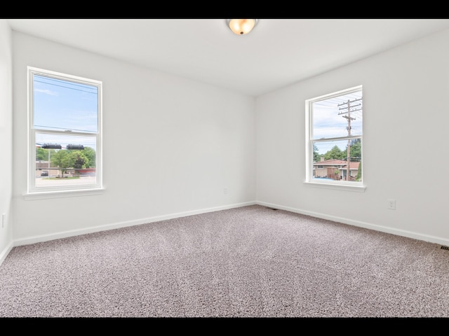 unfurnished room featuring carpet floors