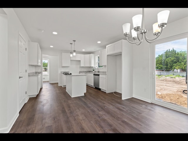 kitchen with a kitchen island, decorative light fixtures, white cabinetry, dishwasher, and dark hardwood / wood-style flooring