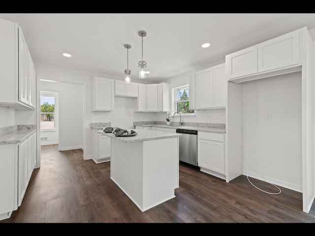 kitchen featuring white cabinetry, dishwasher, and a kitchen island