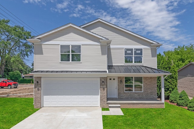 view of front of property featuring a garage, a front yard, and a porch