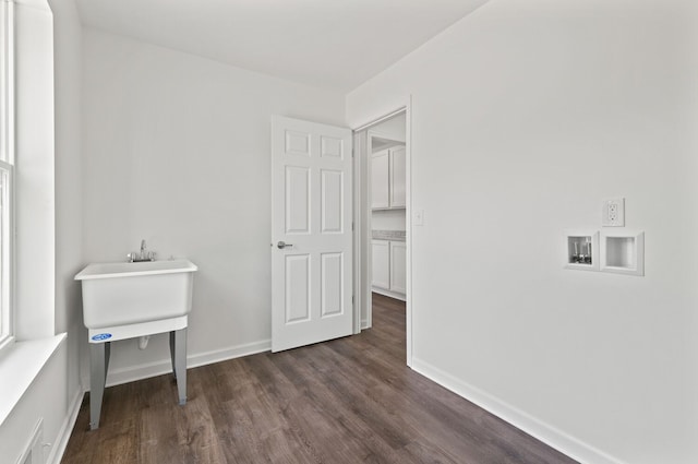 laundry room with hookup for a washing machine and dark wood-type flooring