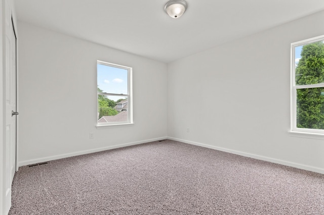 unfurnished room with carpet floors