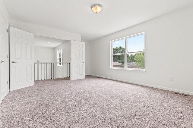 spare room with carpet flooring