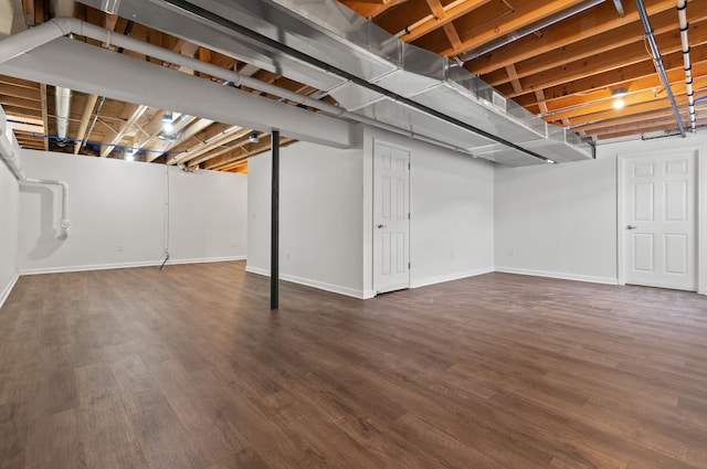 basement featuring dark wood-type flooring