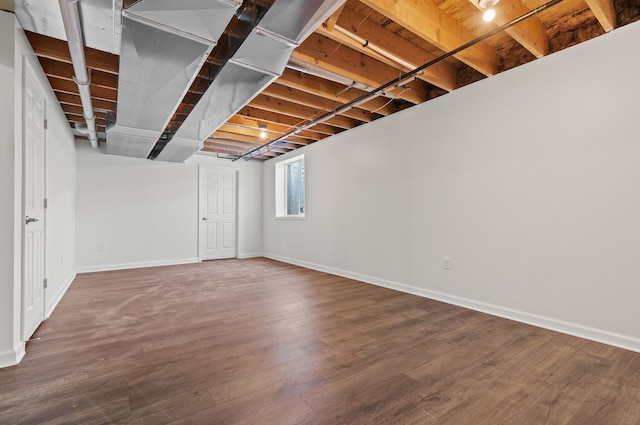 basement with wood-type flooring