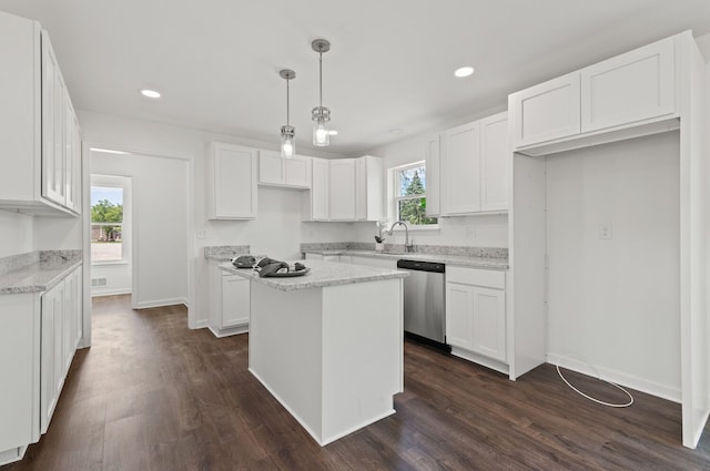 kitchen featuring white cabinetry, a center island, and dishwasher