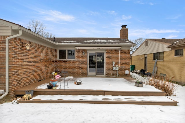 snow covered property featuring a wooden deck