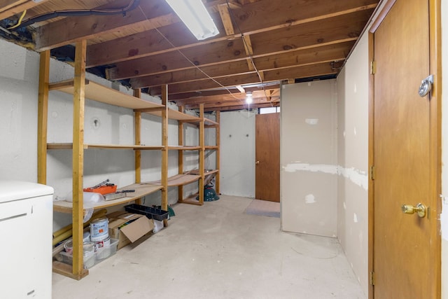 basement featuring fridge