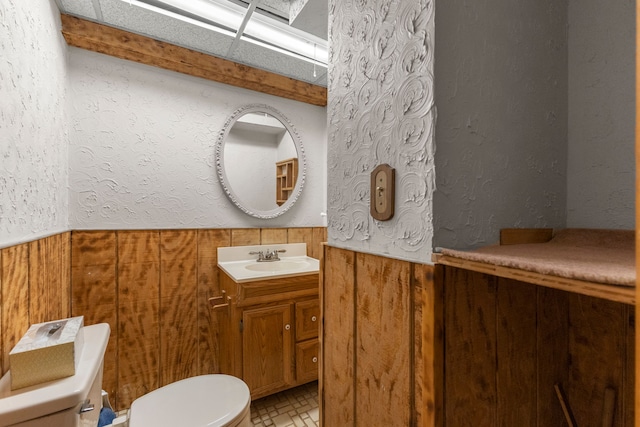 bathroom with tile patterned floors, vanity, and toilet