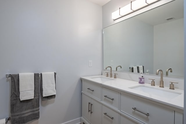 bathroom with vanity and a skylight