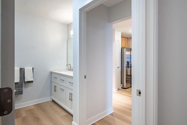 bathroom featuring vanity and hardwood / wood-style flooring