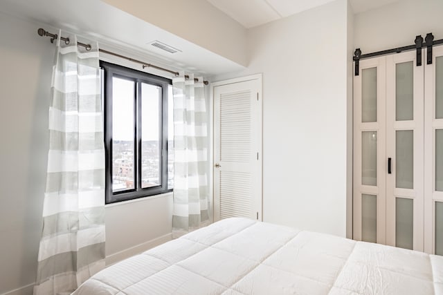 bedroom with a barn door