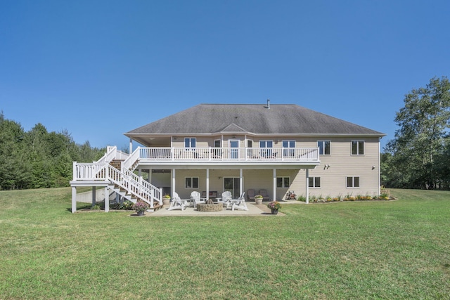 1084 38th St, Allegan, MI 49010 - back of property with a wooden deck, a yard, and a patio area