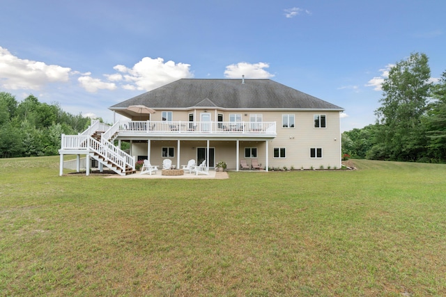 1084 38th St, Allegan, MI 49010 - rear view of property with a wooden deck, a yard, a patio area, and an outdoor fire pit
