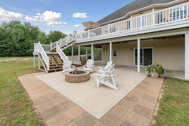 1084 38th St, Allegan, MI 49010 - view of patio / terrace featuring a wooden deck and a fire pit
