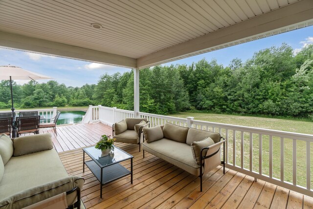 1084 38th St, Allegan, MI 49010 - wooden terrace featuring a water view and an outdoor hangout area