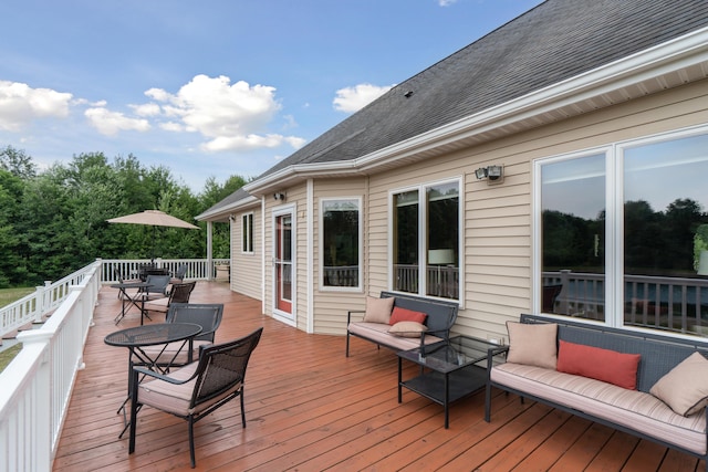 1084 38th St, Allegan, MI 49010 - wooden terrace with an outdoor hangout area