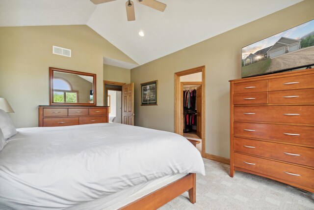 1084 38th St, Allegan, MI 49010 - carpeted bedroom featuring vaulted ceiling, a walk in closet, ceiling fan, and a closet