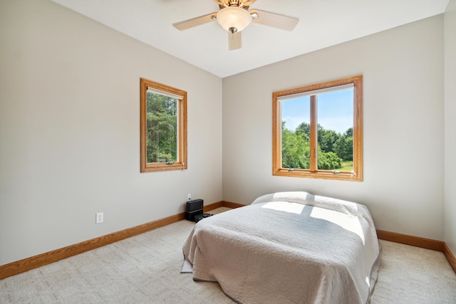 1084 38th St, Allegan, MI 49010 - bedroom with ceiling fan and light carpet