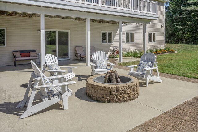 1084 38th St, Allegan, MI 49010 - view of patio / terrace featuring a balcony and a fire pit