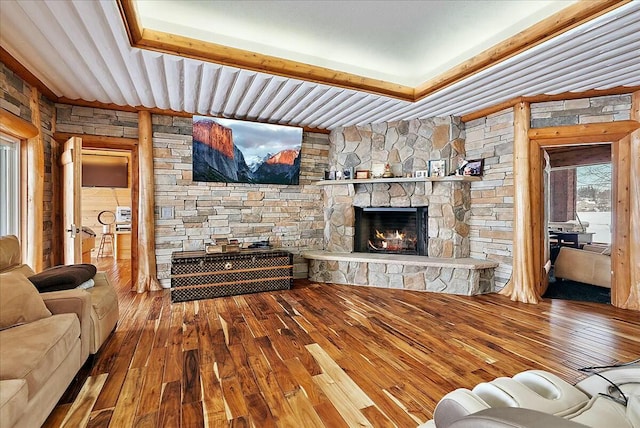 living room with wood-type flooring and a fireplace