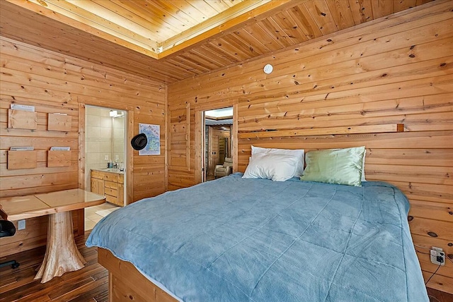 bedroom featuring ensuite bath, wooden walls, and wooden ceiling