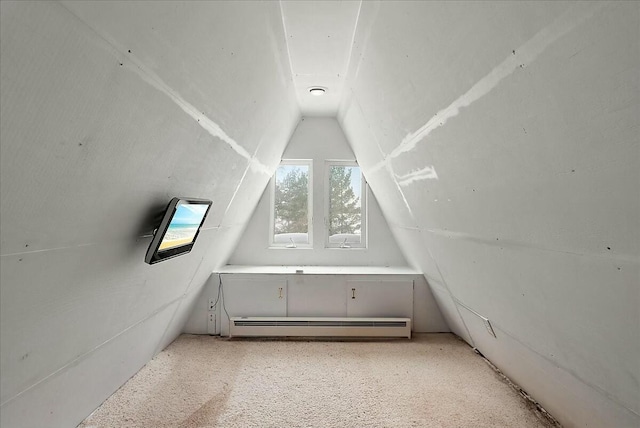 bonus room featuring lofted ceiling, a baseboard heating unit, and light carpet