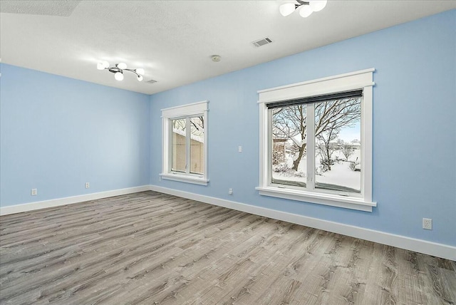 empty room with light wood-type flooring