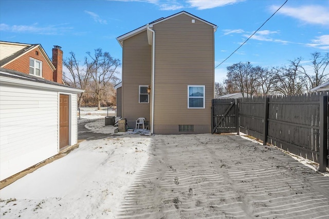 rear view of house with cooling unit