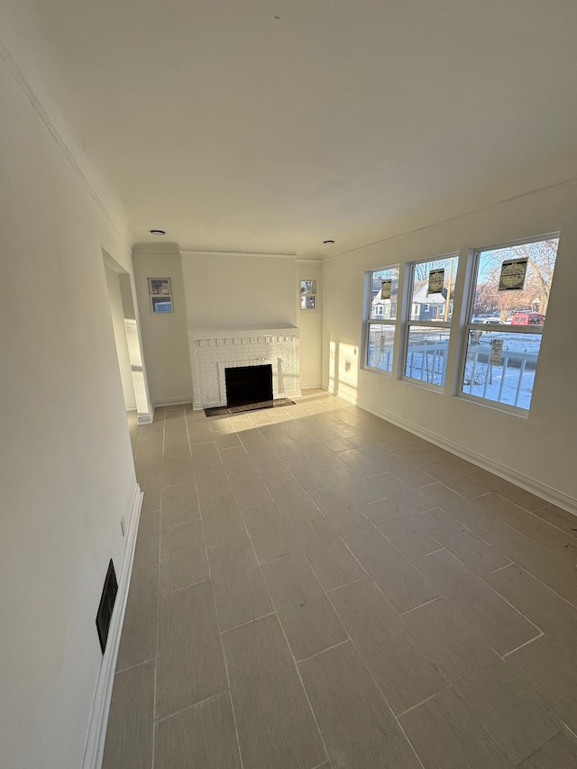 unfurnished living room featuring a fireplace