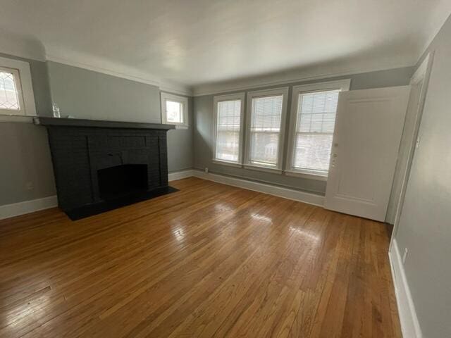 unfurnished living room featuring hardwood / wood-style floors