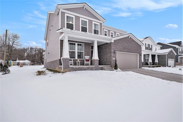 view of front of home featuring a porch and a garage