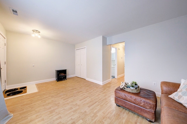 living room with light hardwood / wood-style flooring