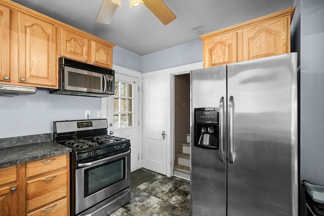 kitchen with appliances with stainless steel finishes and ceiling fan