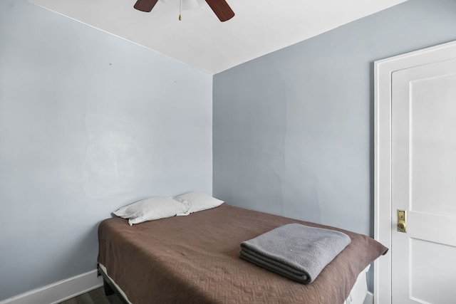 bedroom featuring hardwood / wood-style flooring and ceiling fan