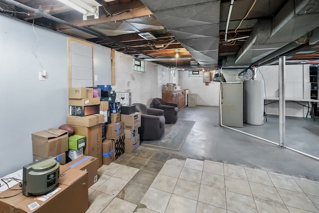 basement with gas water heater and electric panel