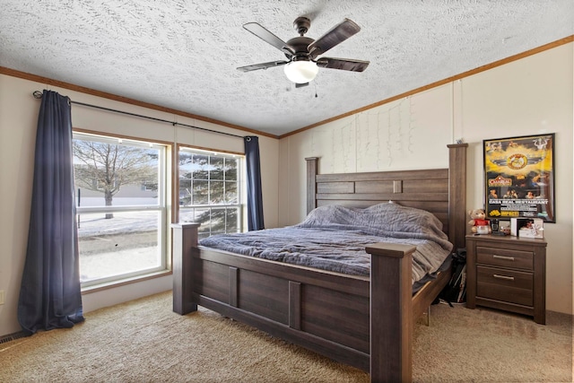 carpeted bedroom featuring ornamental molding, a textured ceiling, and ceiling fan